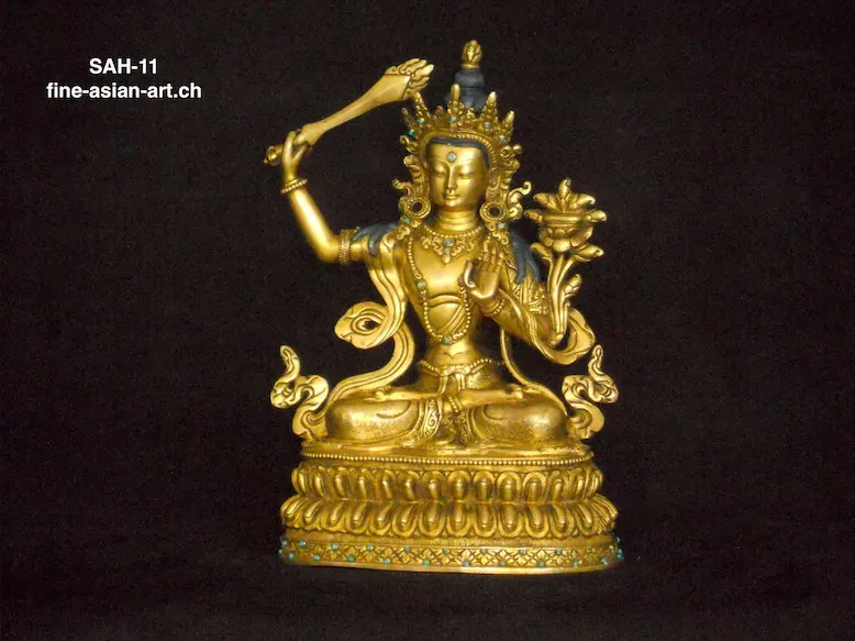 Vergoldeter gekrönter Manjushri mit erhobenem Schwert und Lotos auf doppeltem Lotossockel